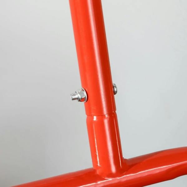 Red steel lawn roller frame with secured bolt connection on upright handle support