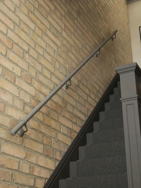 Luddington textured grey straight flight handrail showing industrial look against a brick wall