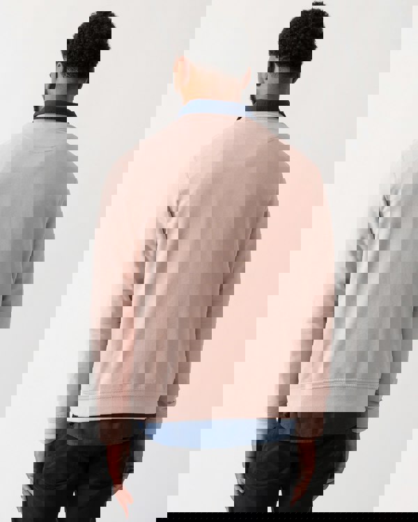 back shot of a model wearing a Belstaff Mens Crew Neck Sweatshirt With Logo Patch in Dusk Pink