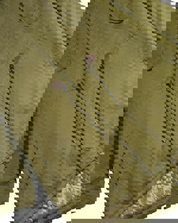 Lambretta Mens Cotton Classic Hooded Classic Badge Parka Coat, close-up view of the olive green parka highlighting the fabric texture, drawstrings, and pocket details.