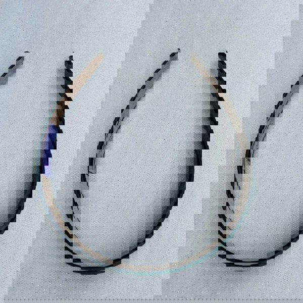 Dark green hairband, smooth satin finish, padded structure, rich deep green colour, minimalist classic design, versatile everyday accessory
