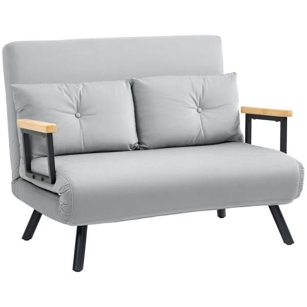 Light grey velvet-feel sofa bed with two tufted pillows