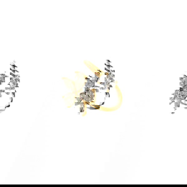 Gold and diamond ear cuff on a white background