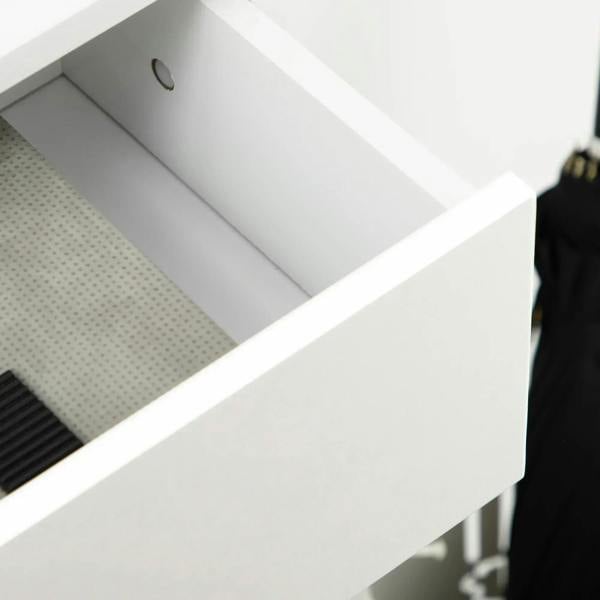White drawer interior with a perforated tray surface for shoes