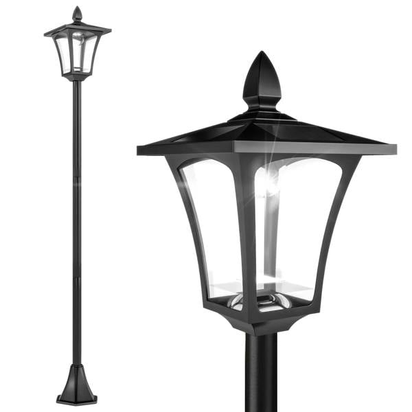 Black solar post lantern with tall pedestal, clear glass panels, lantern-style top