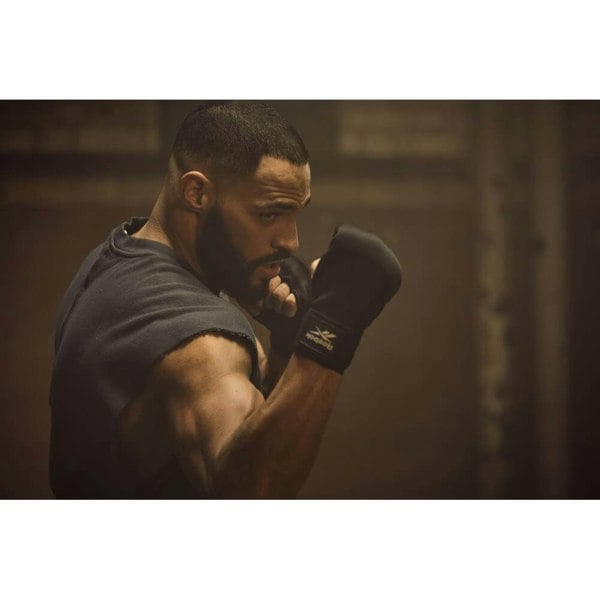 Man working out wearing Reebok Pro Quick Boxing Hand Wraps