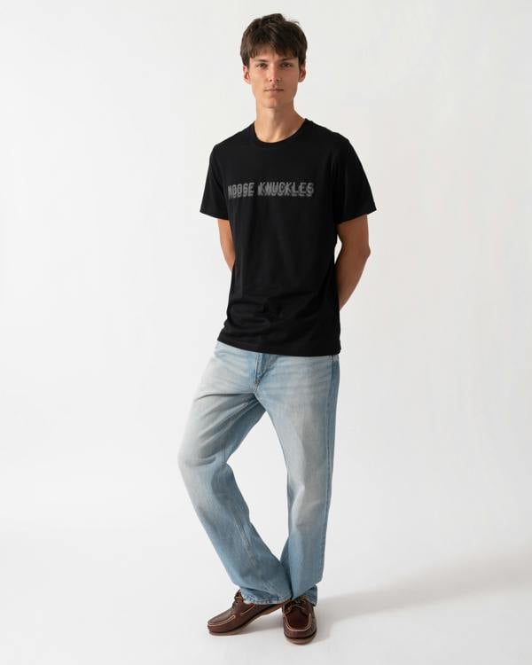 full length of a model wearing a Moose Knuckles Mens Shadow Logo T-Shirt in Black 292
