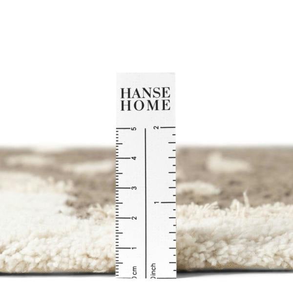 Rug with a ruler for scale, showing 'HANSE HOME' branding.