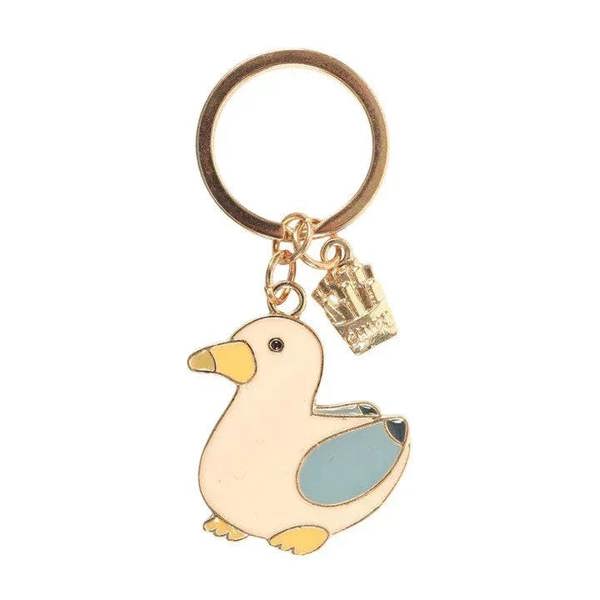 Gold-tone seagull keyring charm with blue enamel chip and small box charm