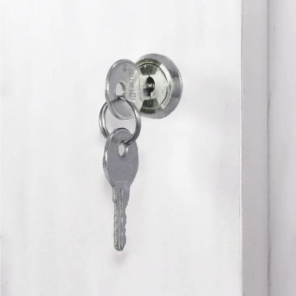 Brilliant white shop counter with a key inserted in a silver lock, showcasing sleek design and modern retail display features