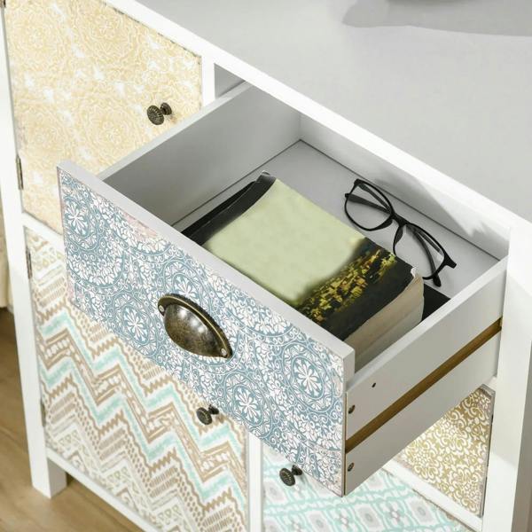 White sideboard with open drawer showing interior storage and patterned front panel