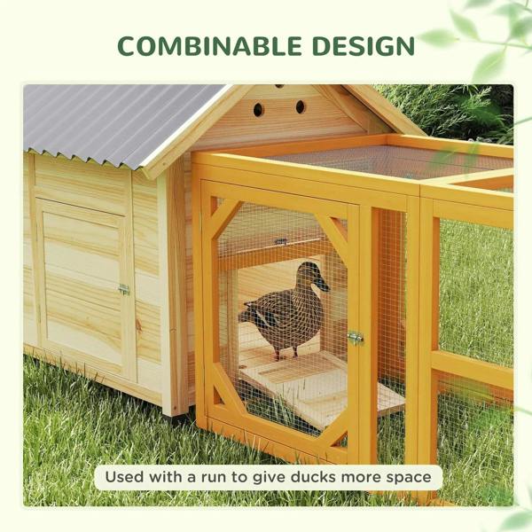 Natural wood duck house attached to a mesh run with front door access