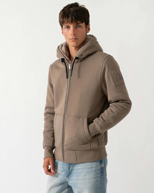 model wearing a Moose Knuckles Classic Bunny 3 Mens Fleece Hoodie in Ashen 2019