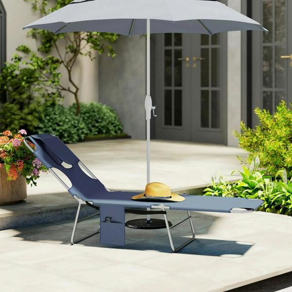 Grey sun lounger with steel frame, head pillow, side pocket, and reclined backrest.