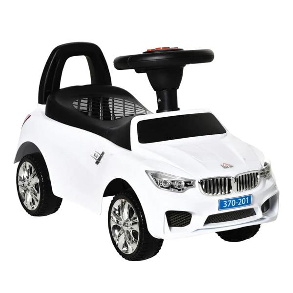 White ride-on toddler car with black steering handle and four shiny wheels