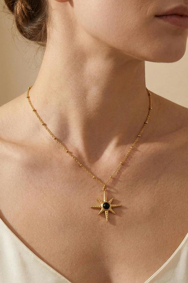 ARIIRA Gaia Gold Tone Starburst Pendant Necklace