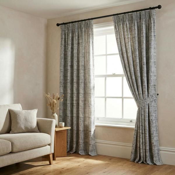 Bobbi made-to-measure curtains in Graphite, styled in a living room