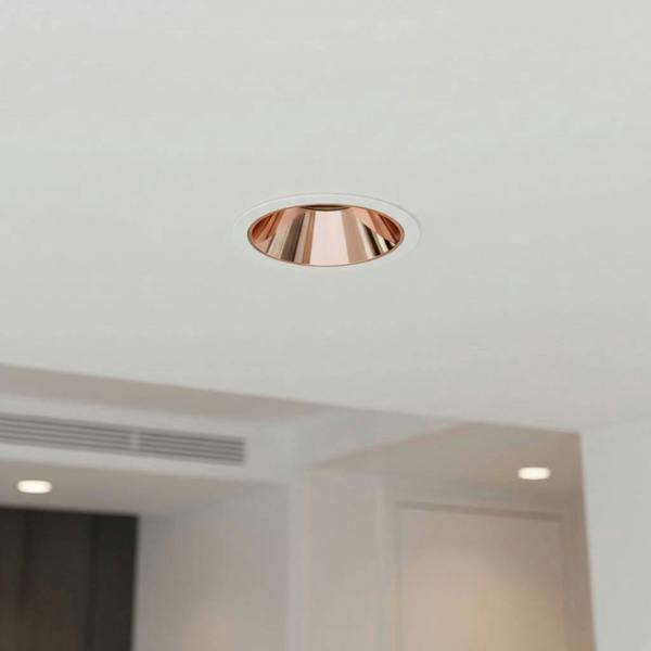 rose gold downlight recessed into a white ceiling 