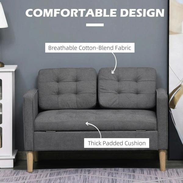 Grey cotton-blend sofa with thick padded seat cushions, tufted back, wood legs