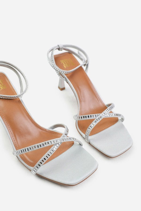 Where's That From Blair Wide Fit Square Toe Low Block Heel With Diamante Cross Over Strap Detail in Silver Satin