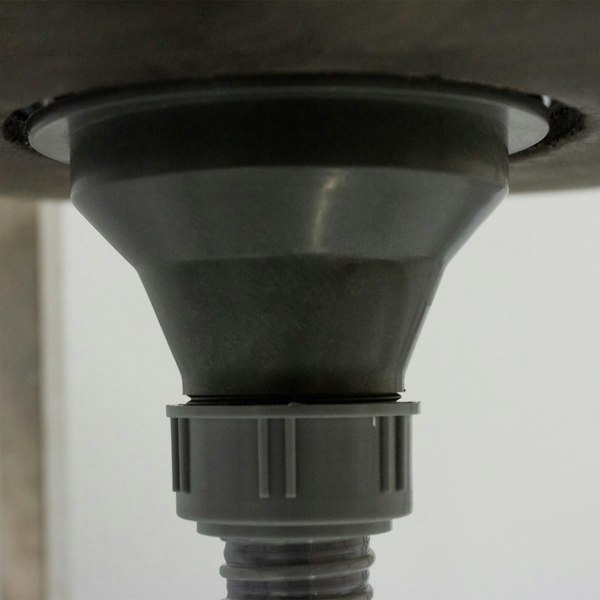 Portable stainless steel camping sink featuring a funnel-shaped drain with a gray plastic connector for easy water disposal