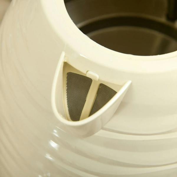Beige kettle spout filter insert, close-up inside the spout