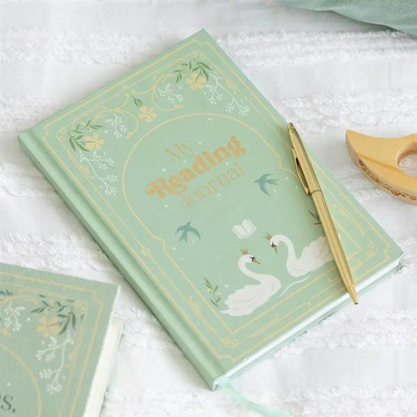 Mint green A5 reading journal notebook with swan design and gold title, front cover.
