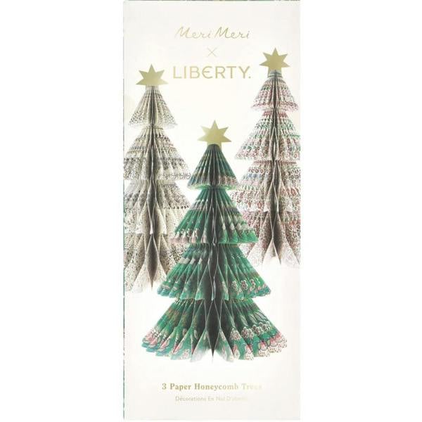 Premium rectangular product packaging for the Meri Meri x Liberty collaboration, featuring illustrations of the three paper honeycomb Christmas trees under gold script branding.