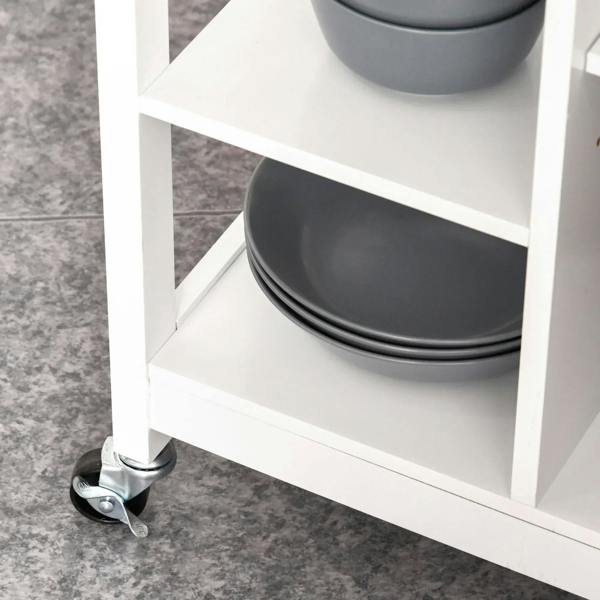 White open shelving kitchen trolley with dark bowls on a lower shelf and caster