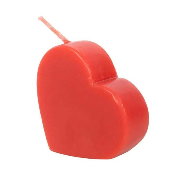 Red heart-shaped candle with wick and molded heart ridges