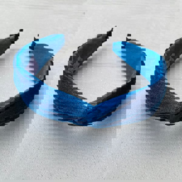 Blue velvet headband, twisted knot design, soft fabric texture, wide band style, elegant decorative hair accessory, chic padded headband
