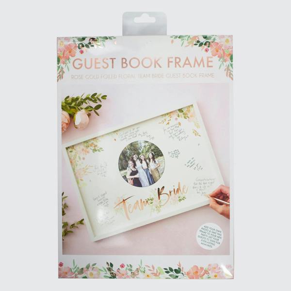 Front view of the retail packaging for the floral Team Bride guest book frame with protective film and a decorative header label.