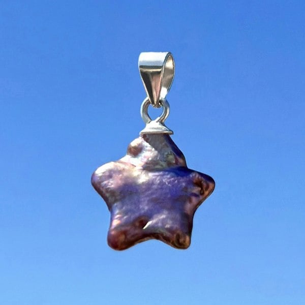 Star-shaped pearl pendant charm, featuring rare pink natural pearls.