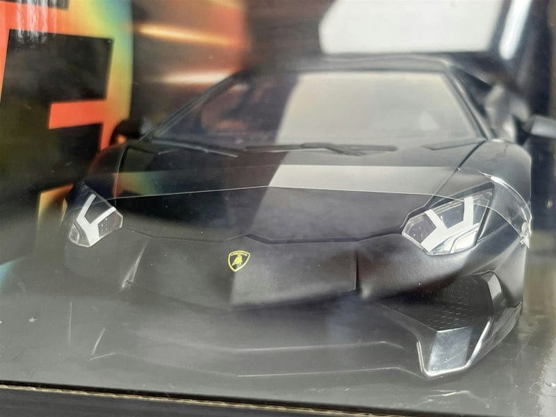 a black sports car in a box