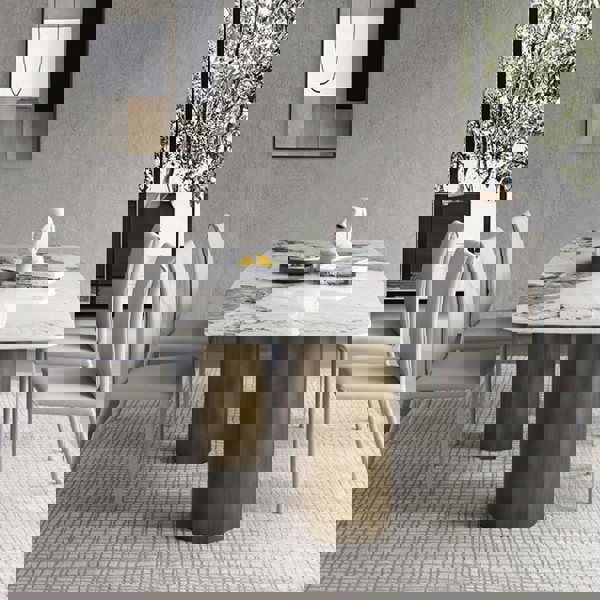 Mira Dining Table, Gold Base in a lifestyle setting with used dining table and chairs