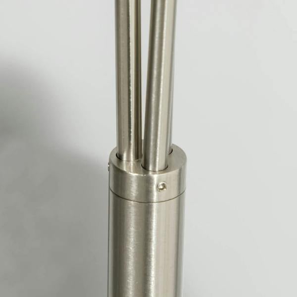 Silver steel base with twin vertical poles for a 3-light floor lamp