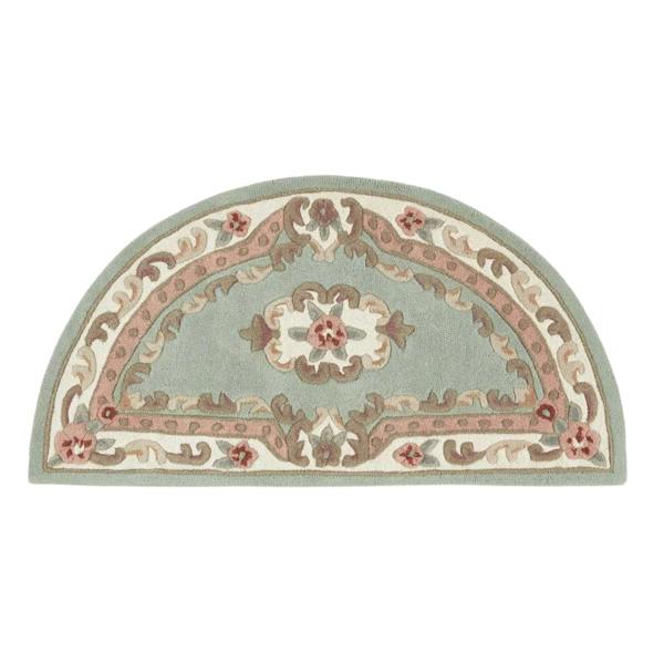 Decorative half-circle rug with floral patterns on a white background