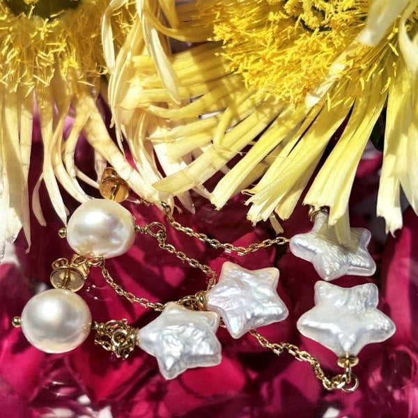 Gold drop earrings featuring star pearls by LENAE London.