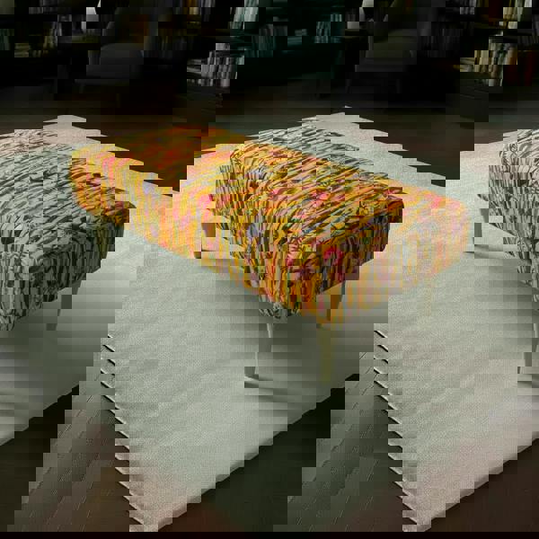 Rectangular coffee table ottoman with vibrant multi-toned abstract fabric