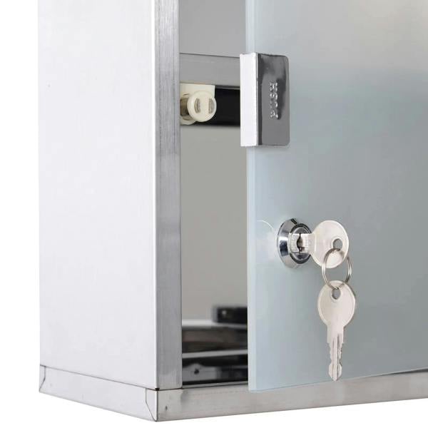 Lockable medicine cabinet with security glass door, key cylinder and keys visible