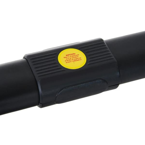 Black treadmill handrail with yellow caution label on the side end cap.