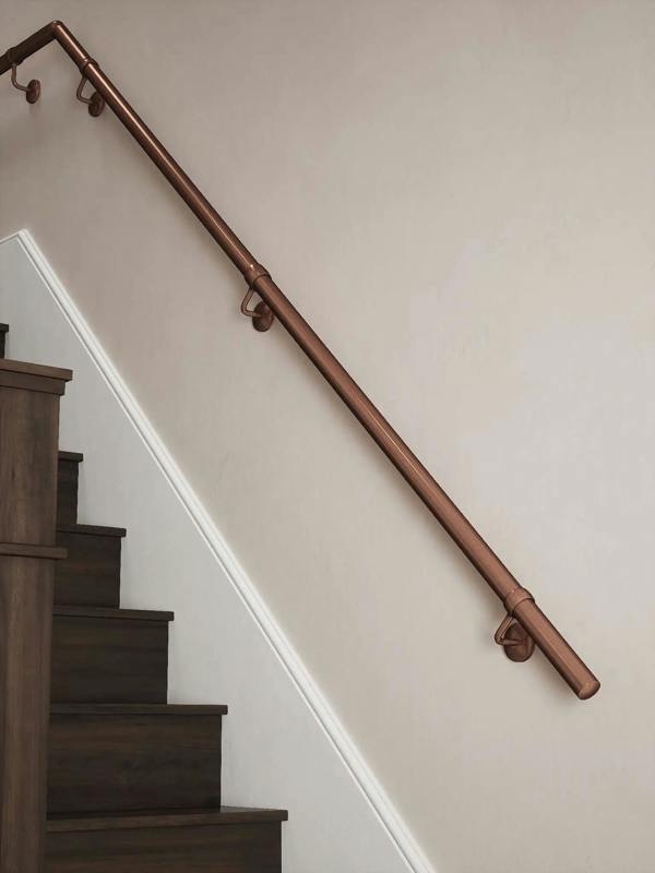 Sambourne Antique Copper Quarter Landing Handrail showing rise and elbow