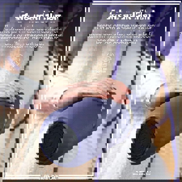 A hand gently holds a blue travel flask with a soft base against a cozy, fleece background. Text reads Safe and Silent The soft pad on the base ensures safe, silent placement on any surface, making it perfect for home, office, or on-the-go use. Soft base TRAVEL FLASK