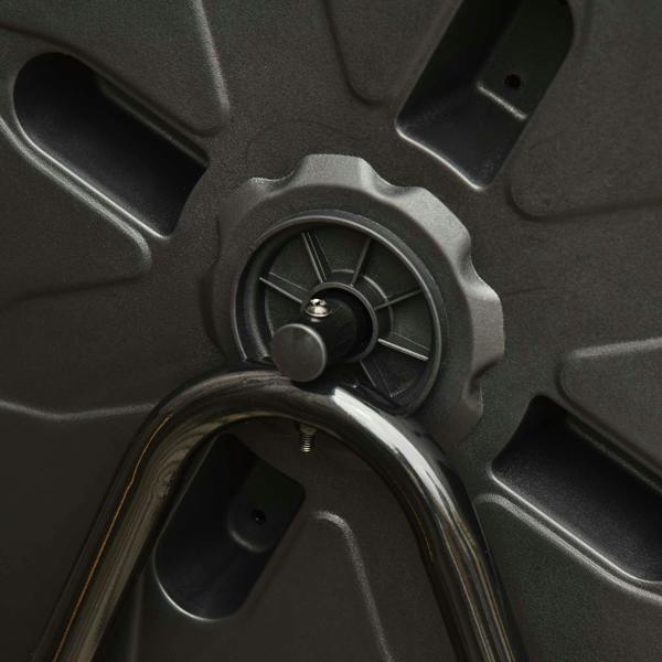 Close-up of rotating composter drum with central hub and vent openings
