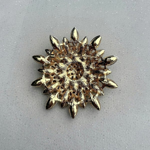 large flower brooch, gold tone, back view, secure pin fastening, statement floral accessory for jackets, coats or shawls
