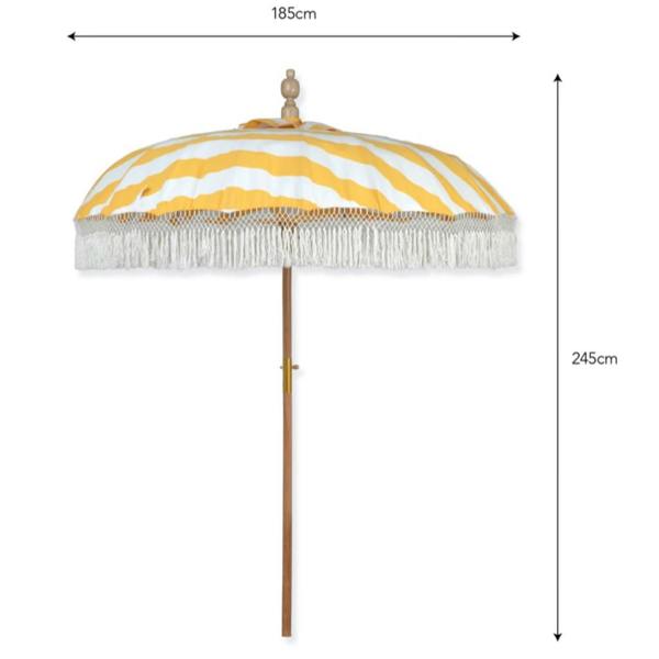 A product sizing diagram for the Sunningdale garden parasol on a white background. Black dimension arrows indicate an open canopy width of 185cm and a total standing height of 245cm. The yellow and white striped umbrella features a teak wood pole and cotton macrame fringe tassels.