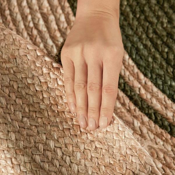 Hand touching a woven textured surface