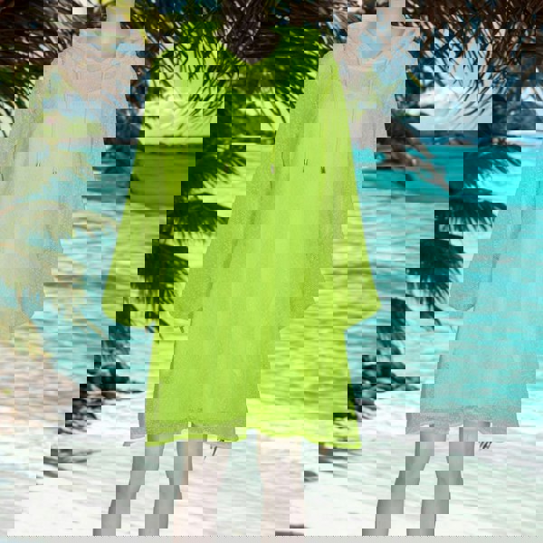 Plus Size Aphrodite Neon Lime Holiday Resort Dress with matching neon lime undergarment and hoodie on mannequin. Short Version as a cut out from the front at the Seychelles.