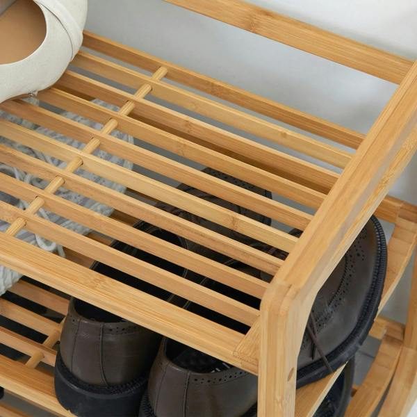 Slatted bamboo shelf on a 3-tier shoe rack with shoes stored underneath