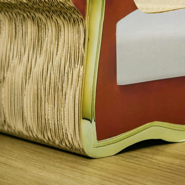 Close-up of beige corrugated cardboard side with gold trim on cat lounge sofa bed